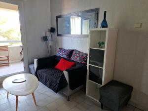 a living room with a couch and a table at les marines de Tamaris in La Seyne-sur-Mer