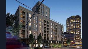 a large building on a city street with buildings at West Heights SE in Croydon