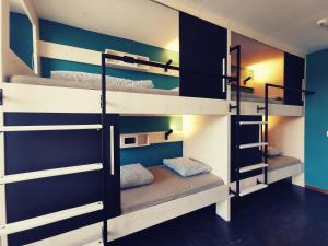 a bunk bed room with three bunk beds at Backpackers Luzern in Lucerne