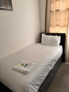 Postel nebo postele na pokoji v ubytování Ivy House Hotel
