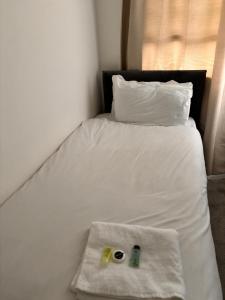 Postel nebo postele na pokoji v ubytování Ivy House Hotel