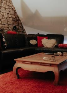 Area soggiorno di L'Eden - Suite privative avec jacuzzi et sauna