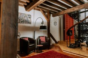 Area soggiorno di L'Eden - Suite privative avec jacuzzi et sauna