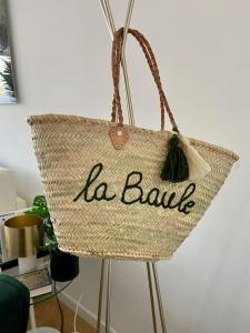 a basket with the word la blau written on it at Le raffiné - Studio avec balcon, proche de l'océan in La Baule