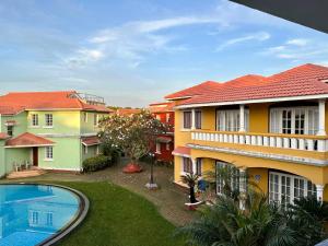 a view of a house with a swimming pool at Leisure By The Beach Goa in Benaulim