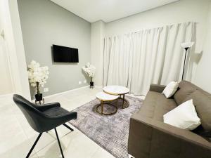 a living room with a couch and a table at Shamah in Pretoria