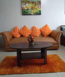 a coffee table in a living room with a couch at Saekyung Village One-Phase 2 in Lapu Lapu City