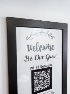 a picture of a sign with a welcome be our guest at Black&White mountain - ADULTS ONLY in Petroşani