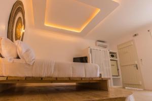 a living room with a couch on a wooden table at Salt Suites by Mr and Mrs White in Pollonia