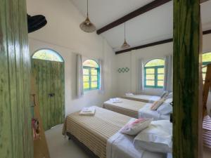 Postel nebo postele na pokoji v ubytování Vila Rita Hostel Arraial d'Ajuda