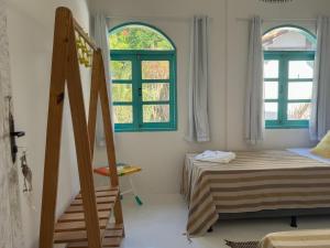 Postel nebo postele na pokoji v ubytování Vila Rita Hostel Arraial d'Ajuda
