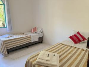 Postel nebo postele na pokoji v ubytování Vila Rita Hostel Arraial d'Ajuda