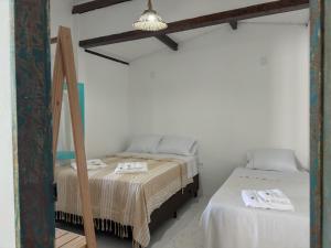 Postel nebo postele na pokoji v ubytování Vila Rita Hostel Arraial d'Ajuda