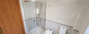 a bathroom with a shower and a toilet at Rotolo Suite 502 in Catania