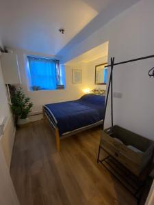 a bedroom with a bed and a window at Chapel Court - Worcester City Centre - Free Parking Available - Entire Apartment - Self Check-In - Outside Space - Free WI-FI in Worcester