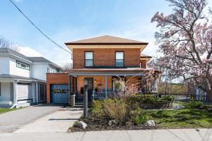 a brick house with a driveway at Merlot on Mary in Picton