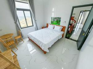 Postel nebo postele na pokoji v ubytování Homestay Tiến Đạt