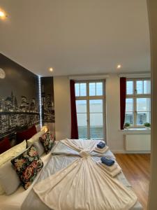 Ein Bett oder Betten in einem Zimmer der Unterkunft Downtown Apartments Leipzig