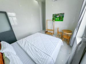 Postel nebo postele na pokoji v ubytování Homestay Tiến Đạt