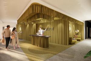 a rendering of a lobby with people standing around a counter at ARCOTEL AQ Wien in Vienna