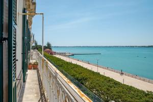 a view of the ocean from a building at Seaview Design Homes in Ortigia by Wonderful Italy in Siracusa