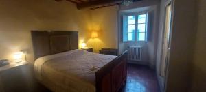 Posteľ alebo postele v izbe v ubytovaní Albergo del Ponte