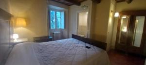 Posteľ alebo postele v izbe v ubytovaní Albergo del Ponte