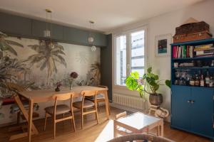 a dining room with a table and chairs at Beautiful family home in Boulogne-Billancourt in Boulogne-Billancourt