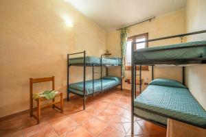 A bed or beds in a room at Brezza di Mare