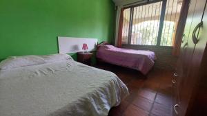 Ένα ή περισσότερα κρεβάτια σε δωμάτιο στο Casa Jusuy