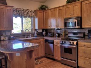 a kitchen with wooden cabinets and a stove top oven at 555 Lancaster St. in Cambria