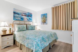 a bedroom with a bed and a window at Gulf Shores Plantation-East 3210 in Gulf Shores +25 photos