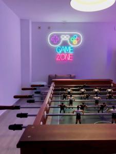 a group of people playing a video game in a gym at Hotel Porto in Gandía