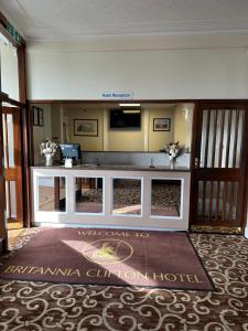 a lobby of a hotel with a reception desk at Clifton Hotel in Scarborough