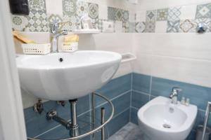 a bathroom with a sink and a toilet at B&b Anna's home in Marina di Camerota