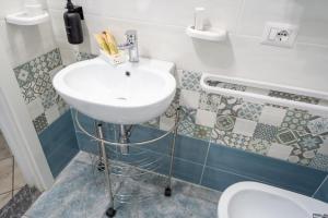 a bathroom with a sink and a toilet at B&b Anna's home in Marina di Camerota