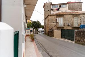 an empty city street with buildings on the side at B&b Anna's home in Marina di Camerota