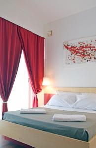 Postel nebo postele na pokoji v ubytování Bio Hotel Palermo