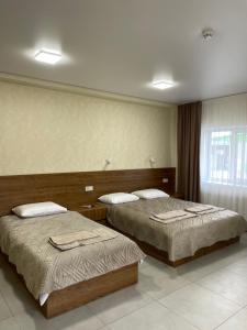 Hotel Voyage Вояж客房内的一张或多张床位
