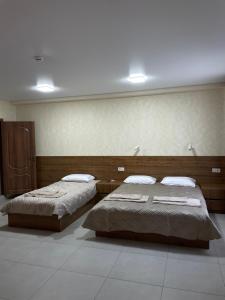 Hotel Voyage Вояж客房内的一张或多张床位