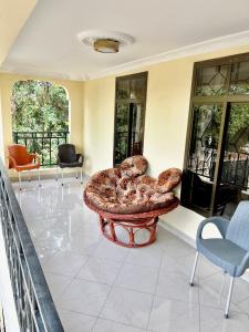 a large room with a table with bread on it at Burka Serene Home in Arusha