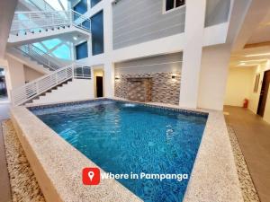 a swimming pool in the middle of a house at Luxury Suite near Clark International Airport in Angeles
