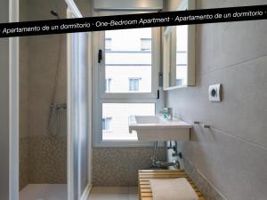 a bathroom with a sink and a window at Tusity Yeah Apartments in Las Palmas de Gran Canaria