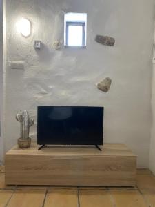a flat screen tv sitting on top of a wooden table at Altea Serenity in Altea