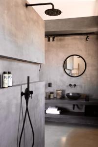 a bathroom with a sink and a mirror at Villa Adokerodes in Ornos