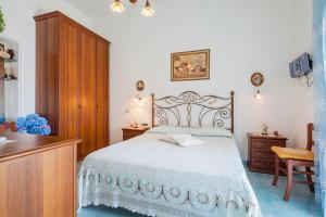 En eller flere senge i et værelse på Divina Costiera Praiano