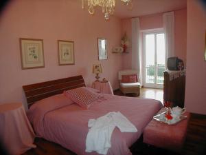 Posteľ alebo postele v izbe v ubytovaní Torre dei Frati Bed & Breakfast