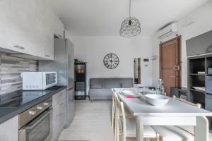 a kitchen with a table and a counter top at Casa Miri - Padova in Padova