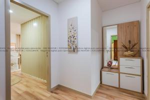 a room with a mirror and a white wall at Imperial apartment 1, 2 e 3 in Braga +45 photos