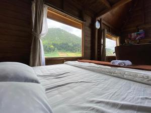 Letto o letti in una camera di Satha private villa Dieng
